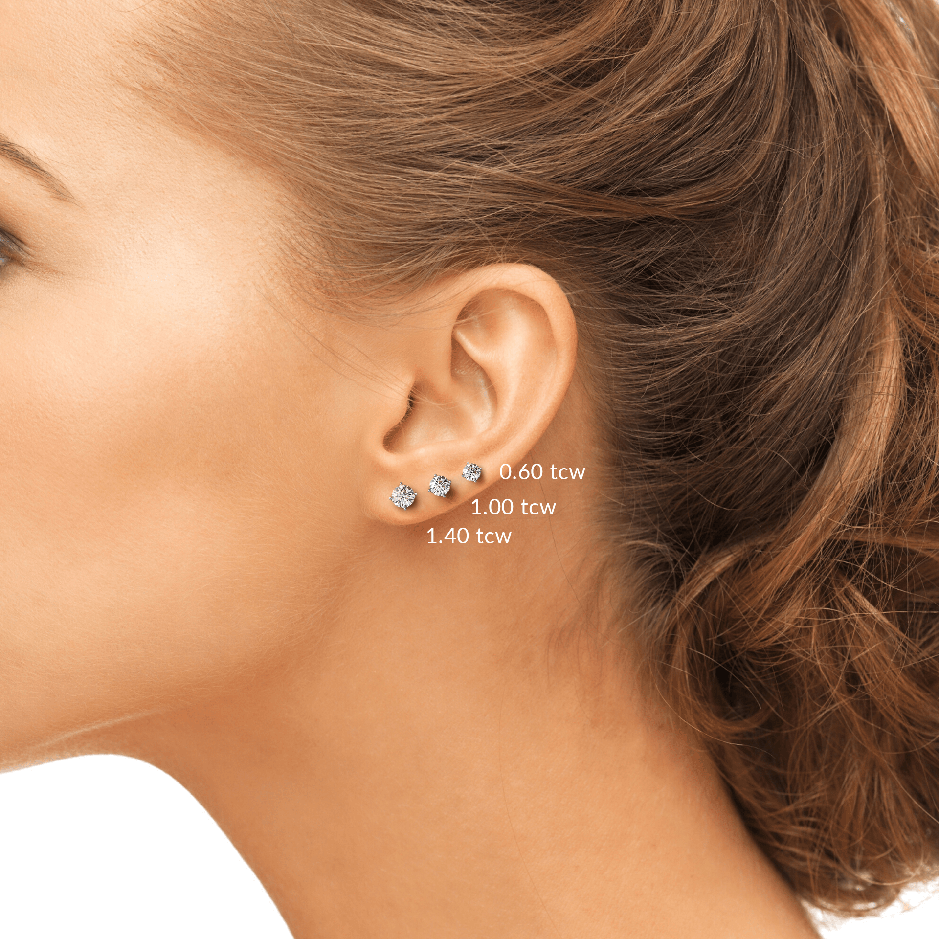Woman wearing Diamond Studs with different sizes